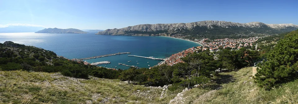 Baška bay and town beneath the limestone hills of Krk