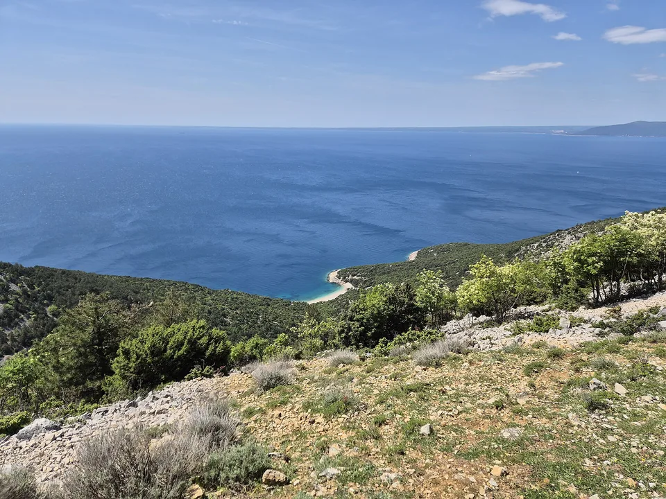 Wooded slopes and Adriatic water seen from Lubenice on Cres