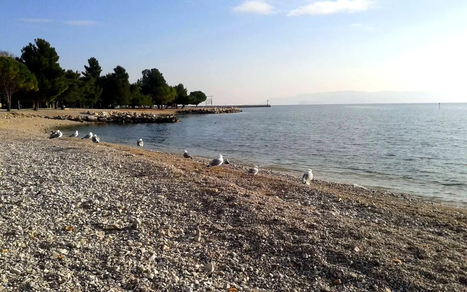Pebble beach and calm sea on the Crikvenica coast