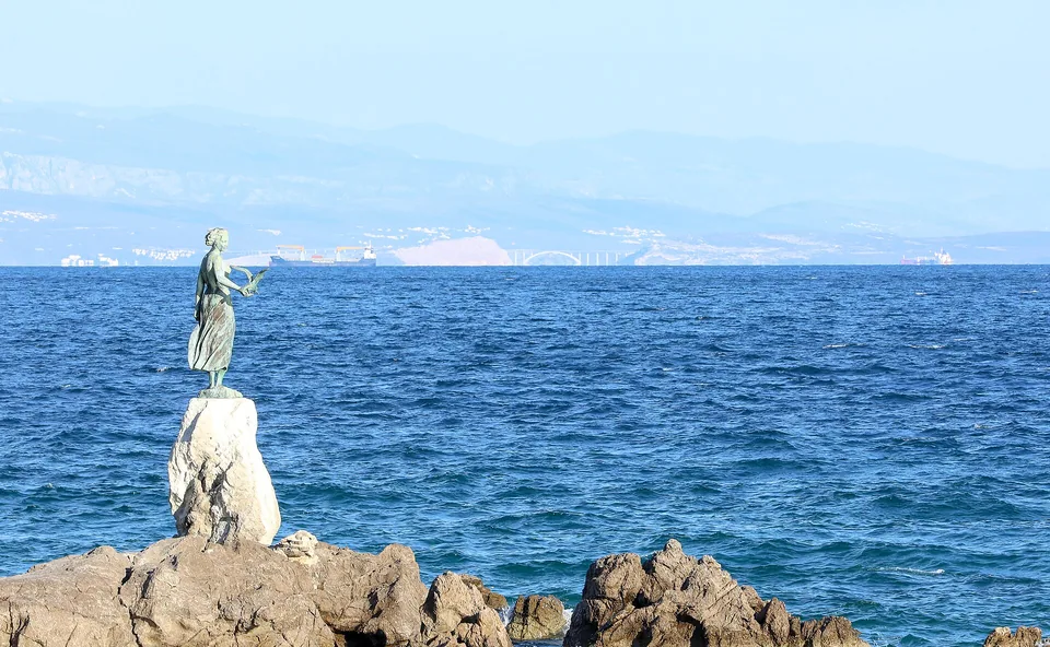 The Maiden with the Seagull statue beside the sea in Opatija