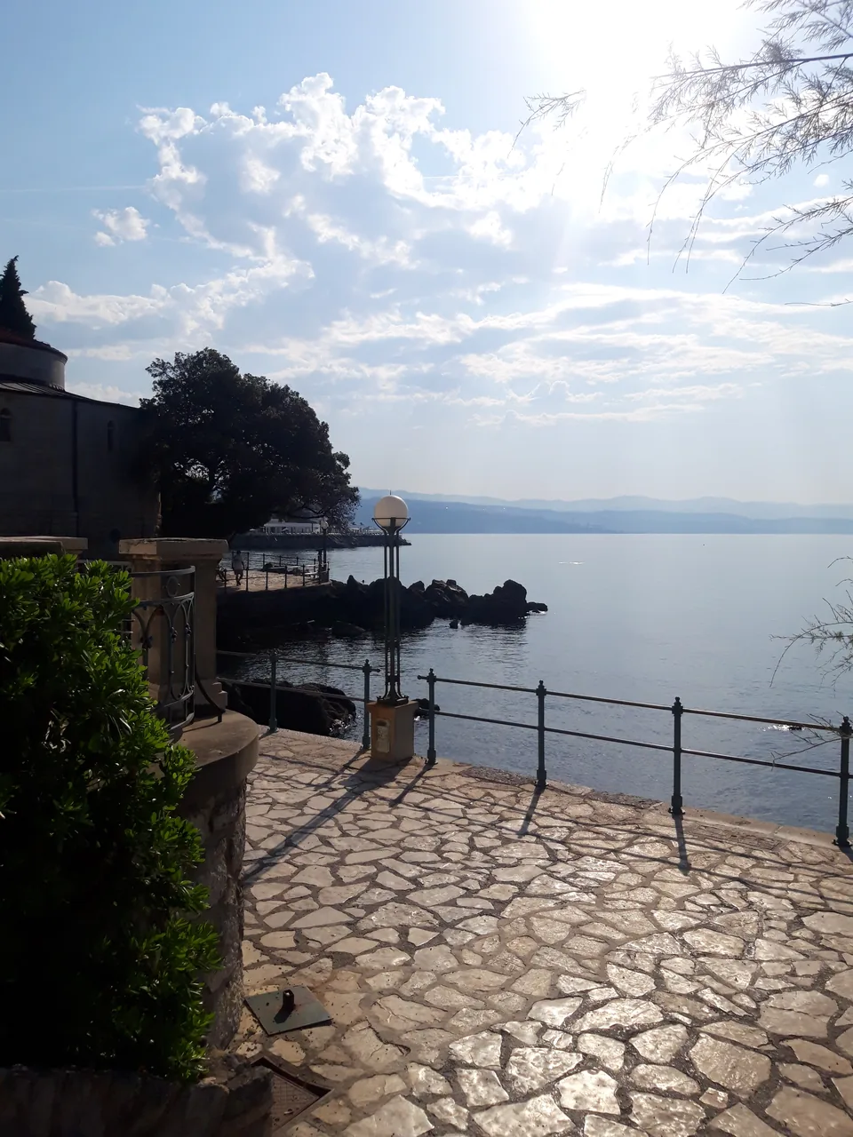 Morning light on the stone Lungomare promenade beside the sea in Opatija