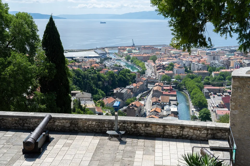 Rijeka and its harbour seen from Trsat Castle, with a cannon in the foreground
